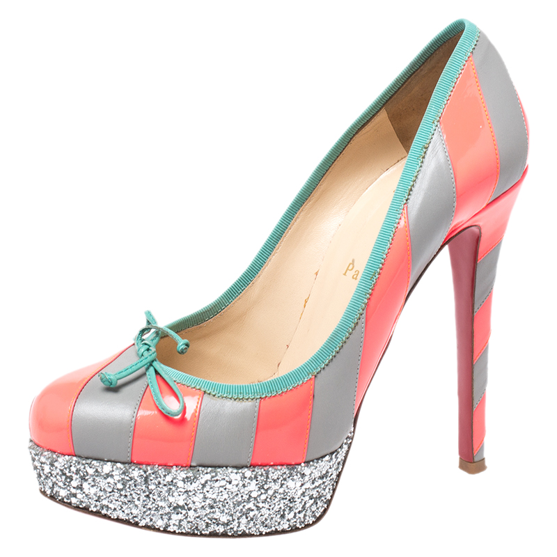What beauty are these pumps from Christian Louboutin Designed with stripes on leather and little ties on the uppers these pumps are so fashionable. Theyll help you stand tall with the glitter platforms and the 13 cm heels.