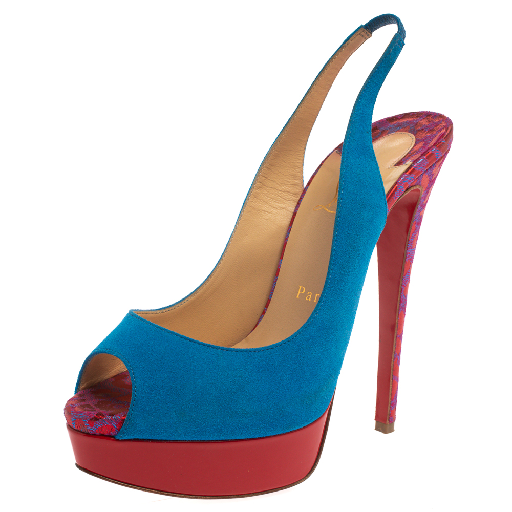 Add vibrancy to your shoe collection with these gorgeous Louboutin sandals that exude high fashion and class Crafted from suede and fabric they belong to the labels Lady Peep collection. The creation features blue and red shades in a peep toe style. These platform sandals are complete with leather insoles stiletto heels and the signature red soles.