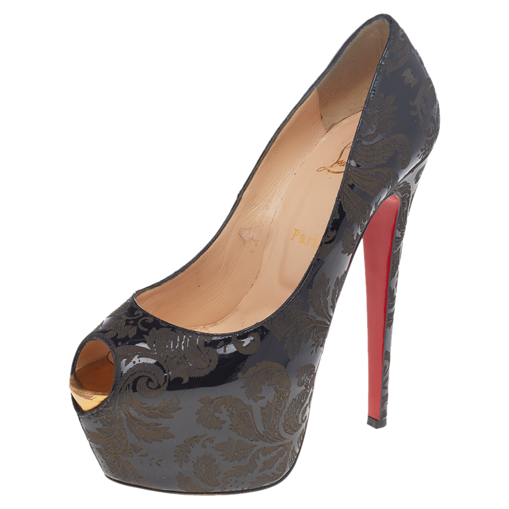 These Highness pumps from the House of Christian Louboutin will bring a sense of drama and grace to your attire. These pumps are created using black patent leather with the arabesque motif print. They are completed with peep toes platforms red soles and towering 16 cm heels.
