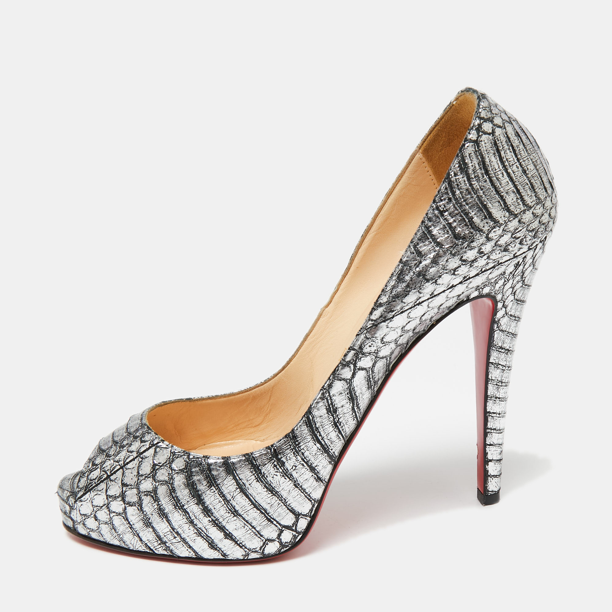 The architectural silhouette and precise cuts of this pair of pumps from Christian Louboutin exemplify the brands mastery in the art of stiletto making. Finely created from snakeskin leather it has been detailed with 12cm heels and peep toes. The signature red lacquered sole will add a touch of luxury to every step.