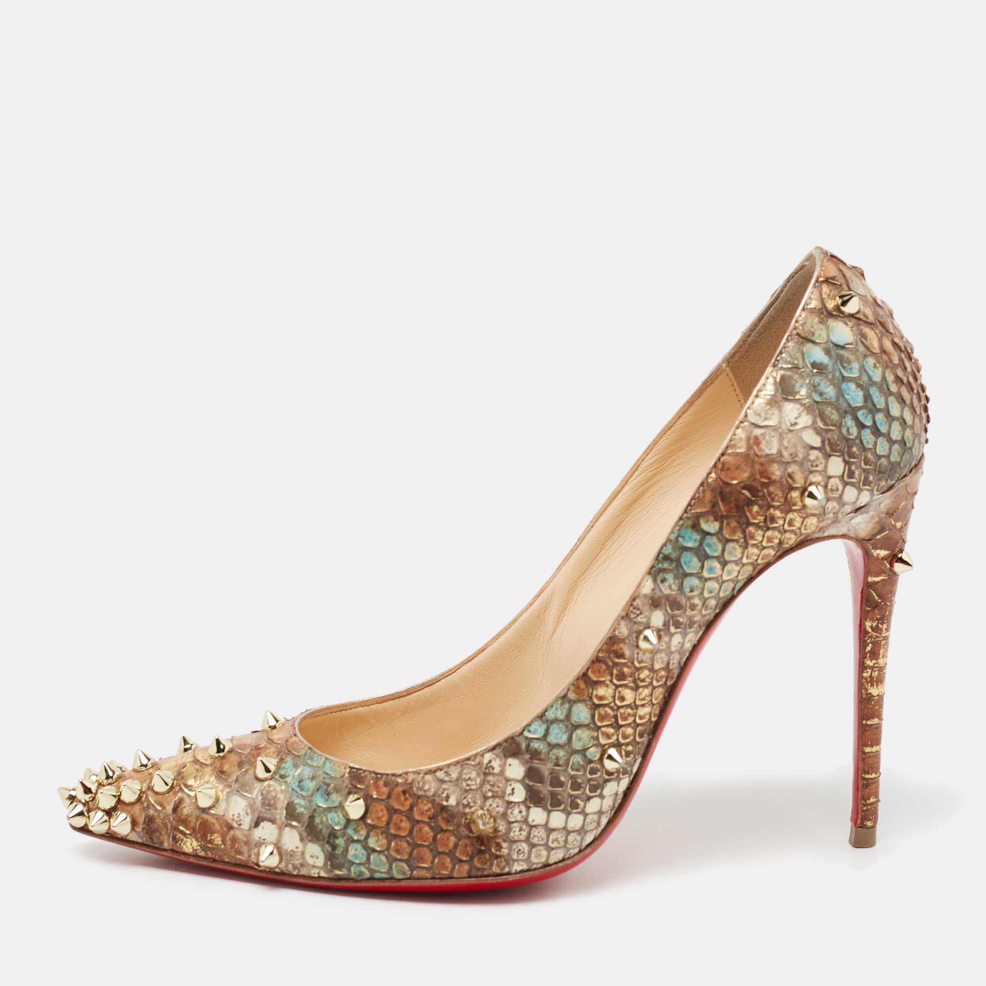 The addition of spikes makes this pair of Christian Louboutin pumps undeniably chic. Crafted from tri color python leather it features 10.5cm heels a signature red lacquered sole and an architectural shape.