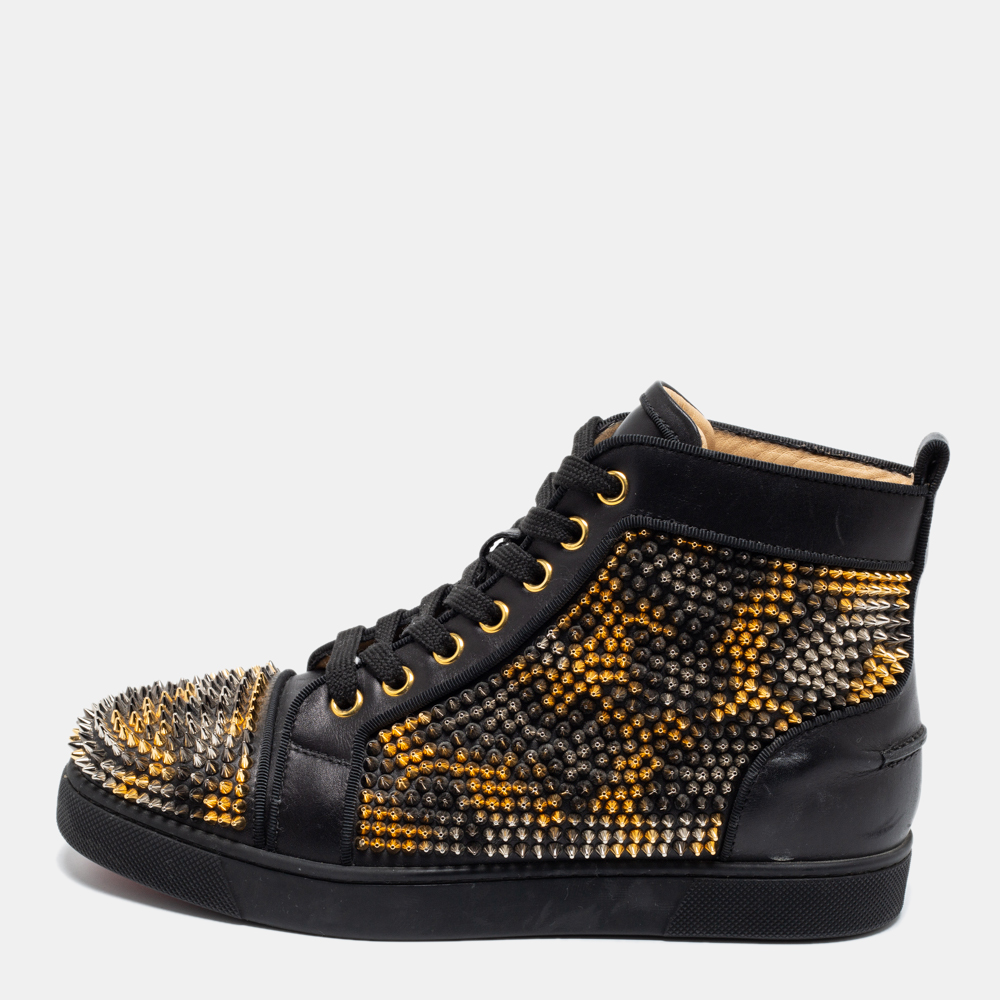 These Louis Spikes sneakers from Christian Louboutin are super sturdy stunning and stylish. They are crafted from black leather into a high top silhouette. Embellished with studded accents they showcase lace up fastenings and silver tone and gold tone hardware. Add these trendy sneakers to your collection now