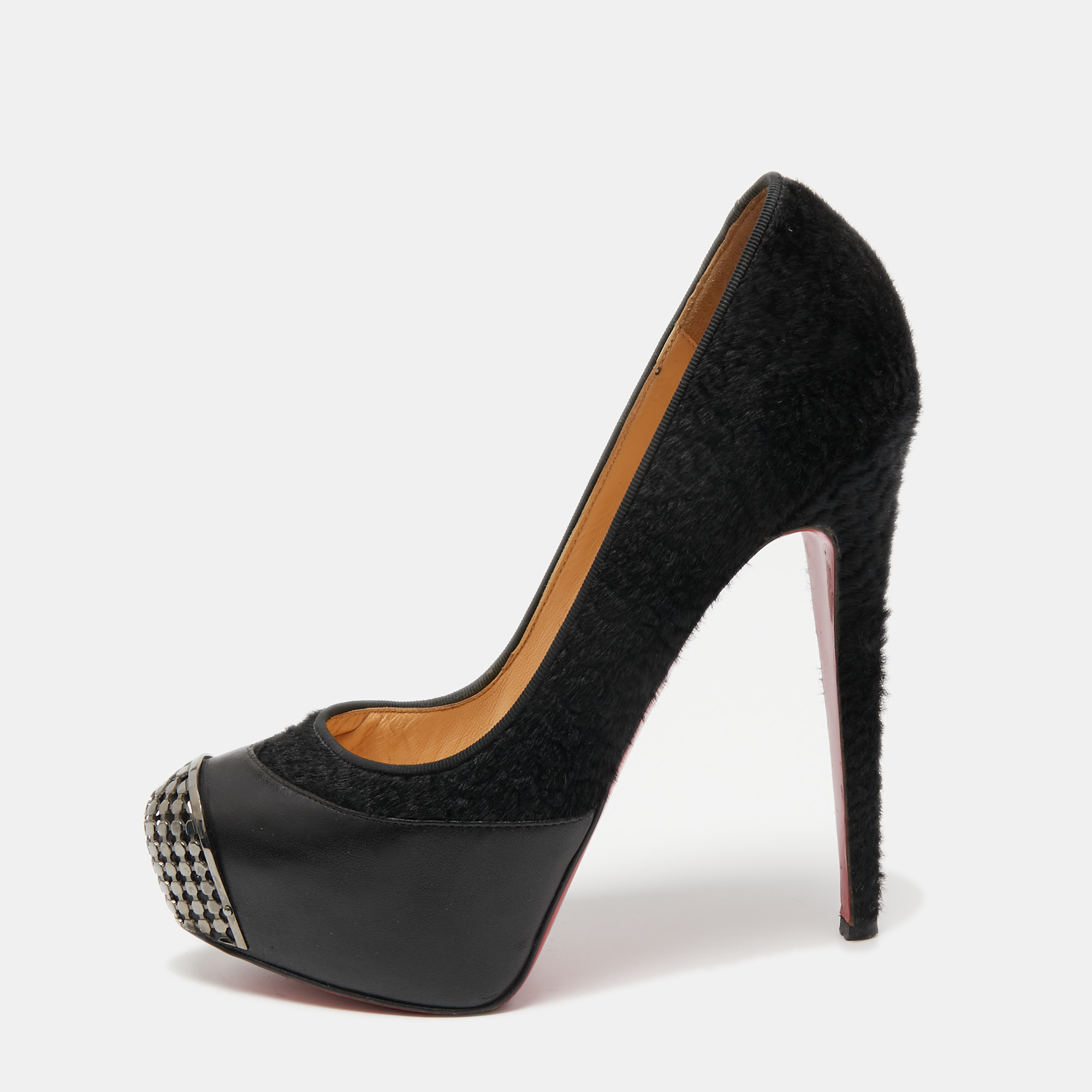 Crafted using leather and calf hair these Christian Louboutin pumps are meant to add a sophisticated finish to your look of the day. The designer pumps feature metal detailed toes platforms and 14.5 cm heels.
