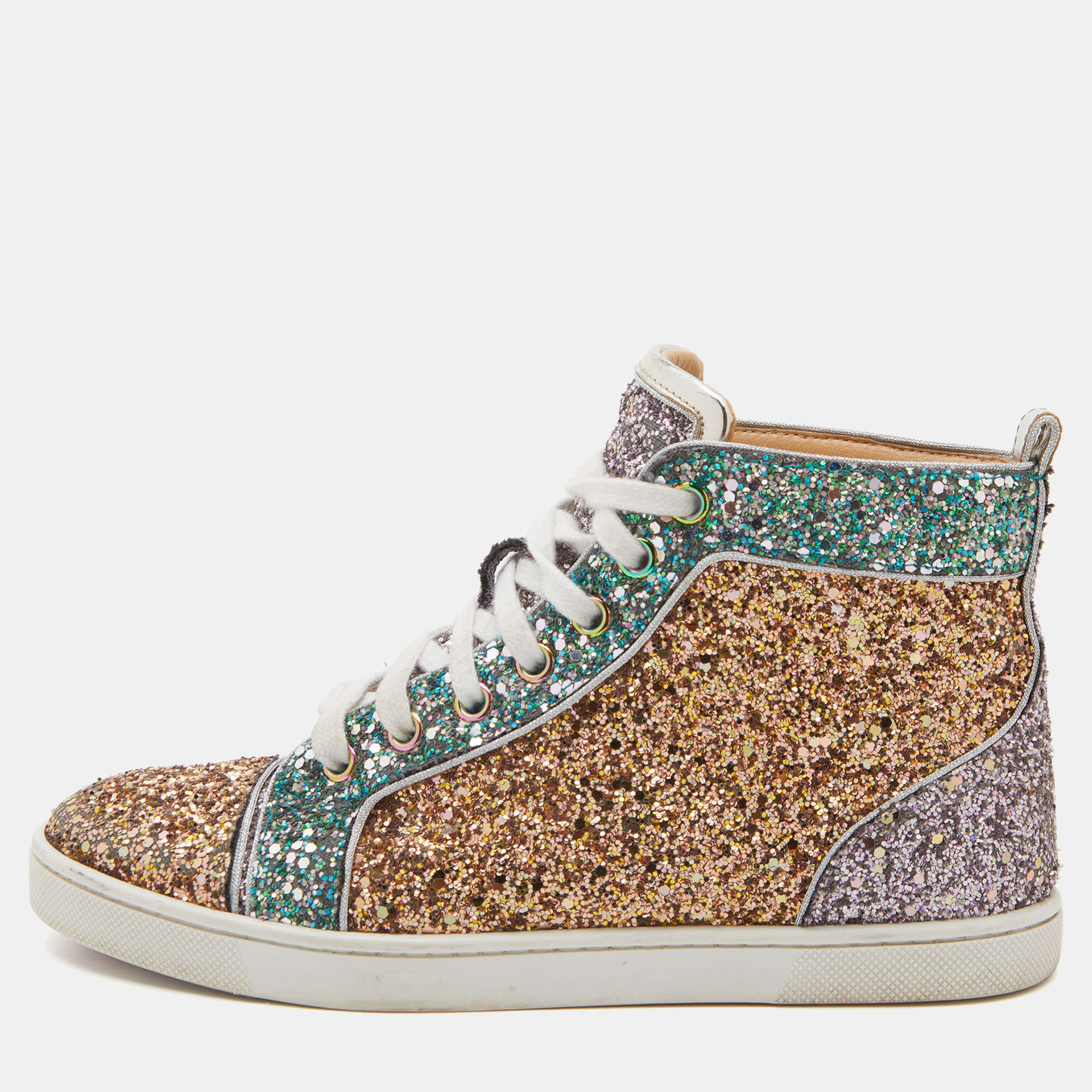 Pull off a stylish look with class in this pair of Bip Bip sneakers from Christian Louboutin. They feature a shimmery glitter body sculpted in a high top silhouette. The sparkly sneakers have lace up fronts round toes and the iconic red soles.