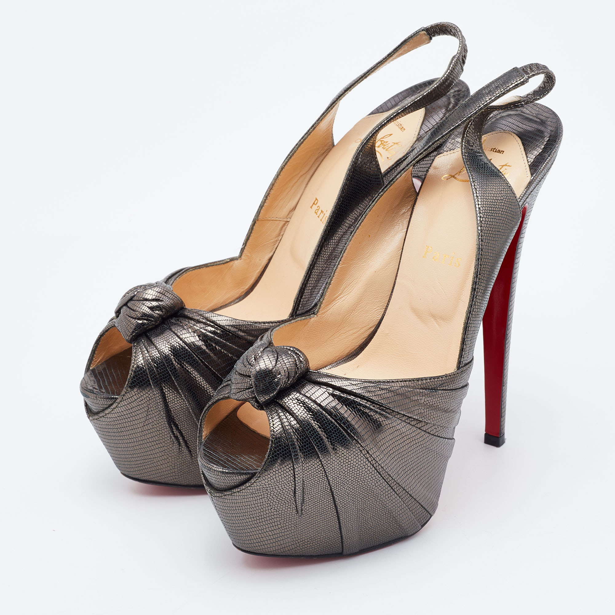 

Christian Louboutin Metallic Grey Laminated Suede Miss Benin Knotted Pumps Size