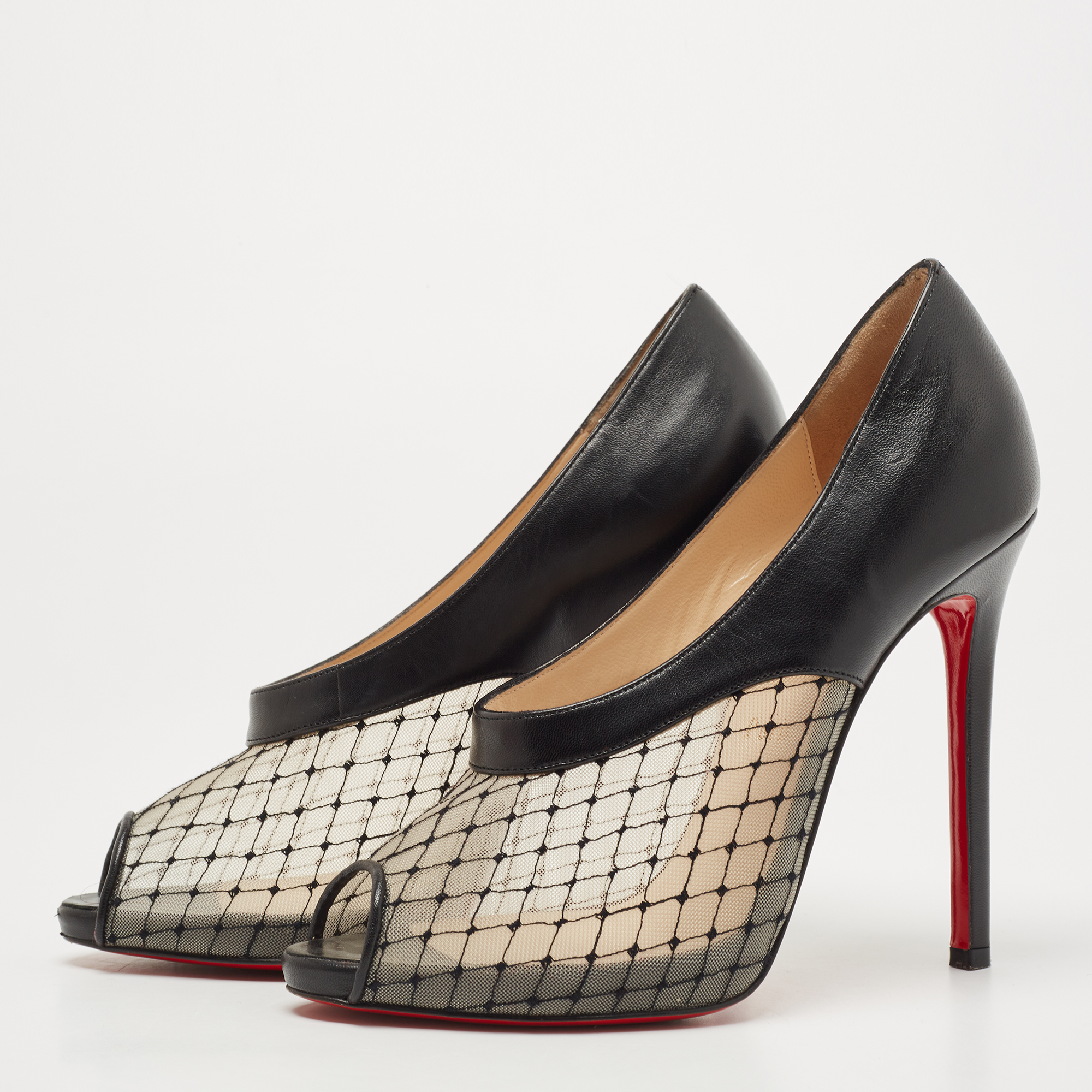 

Christian Louboutin Black Leather and Mesh Resillana Pumps Size