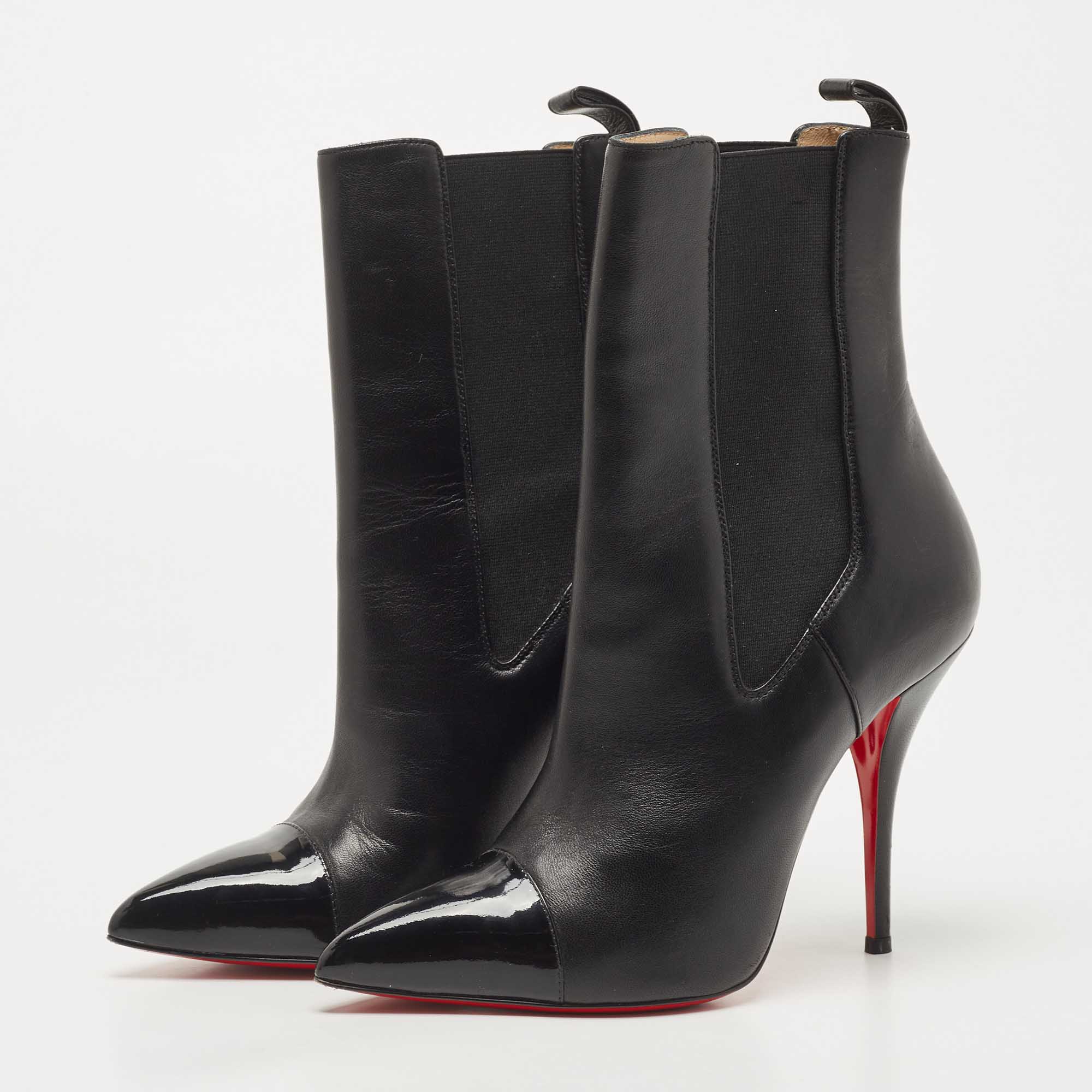 

Christian Louboutin Black Leather and Patent Tuscon Booties Size