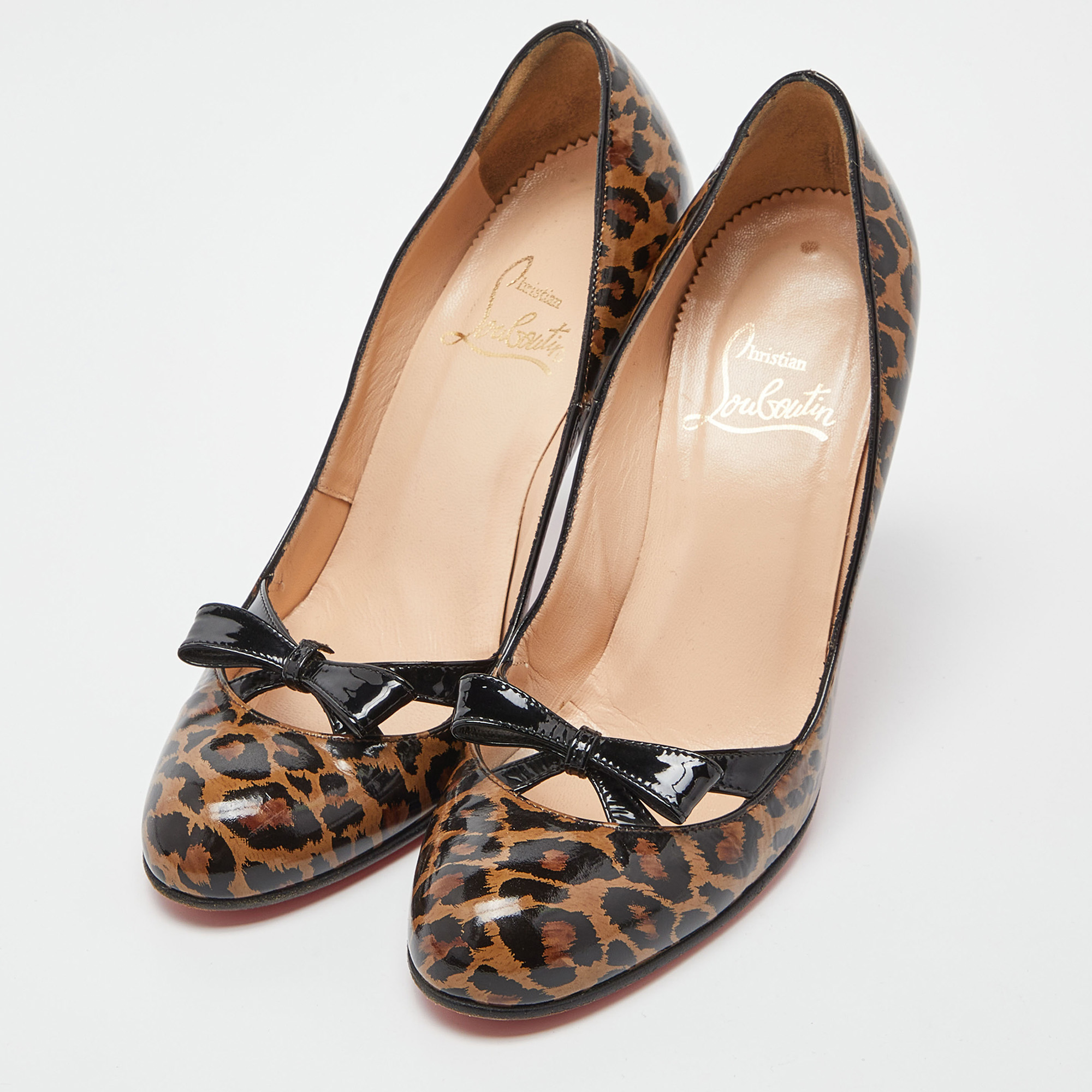 

Christian Louboutin Brown/Black Animal Print Patent Leather Bow Pumps Size