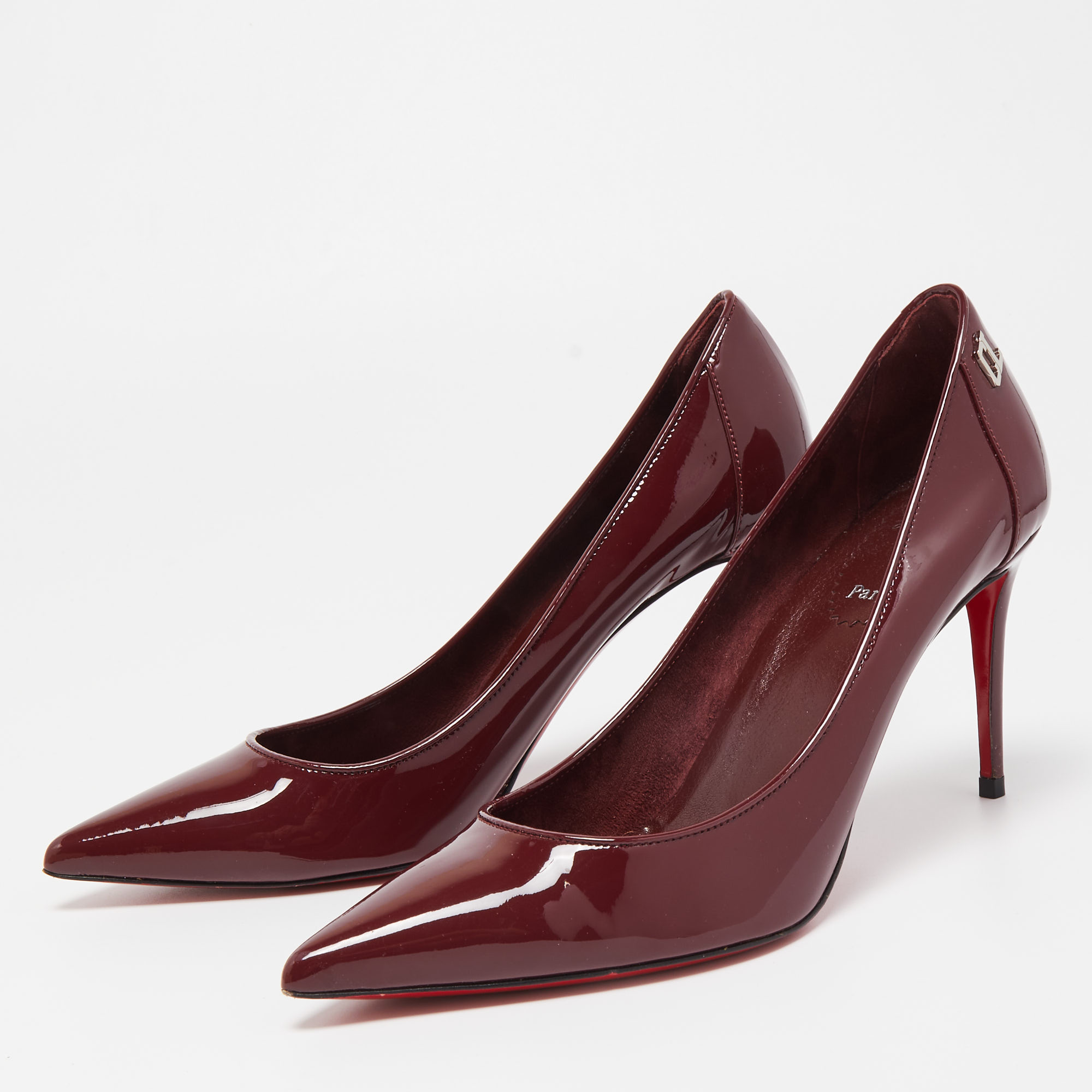 

Christian Louboutin Burgundy Patent Leather Sporty Kate Pumps Size