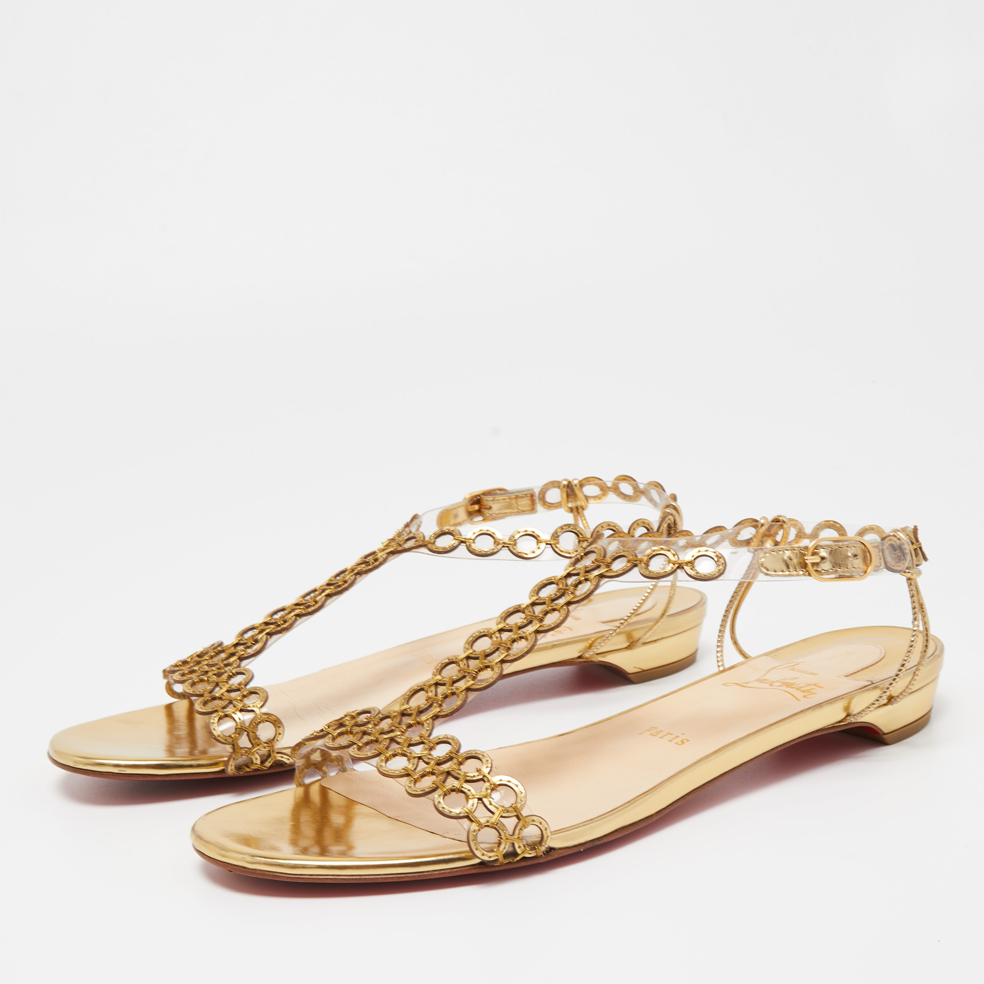 

Christian Louboutin Gold Laser Cut Leather and PVC Flat Sandals Size