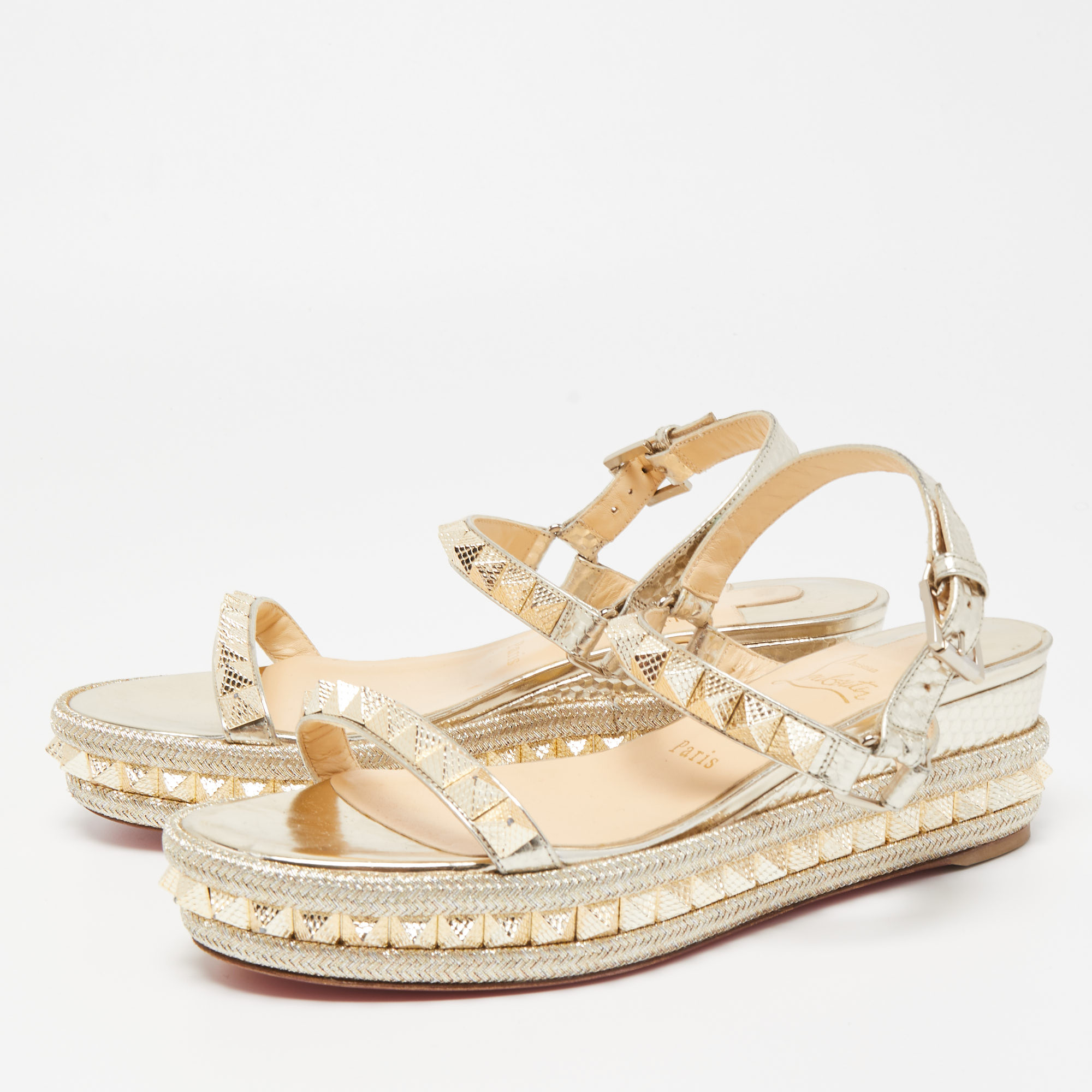 

Christian Louboutin Gold Leather Pyraclou Wedge Sandals Size