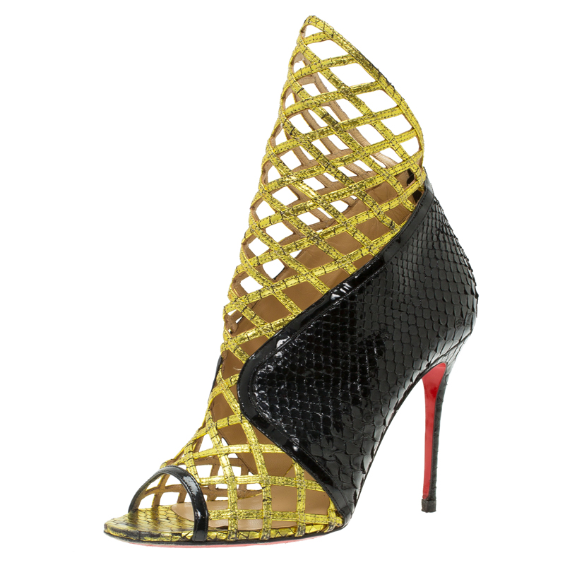 

Christian Louboutin Black and Gold Python Bougliona Cage Ankle Boots Size