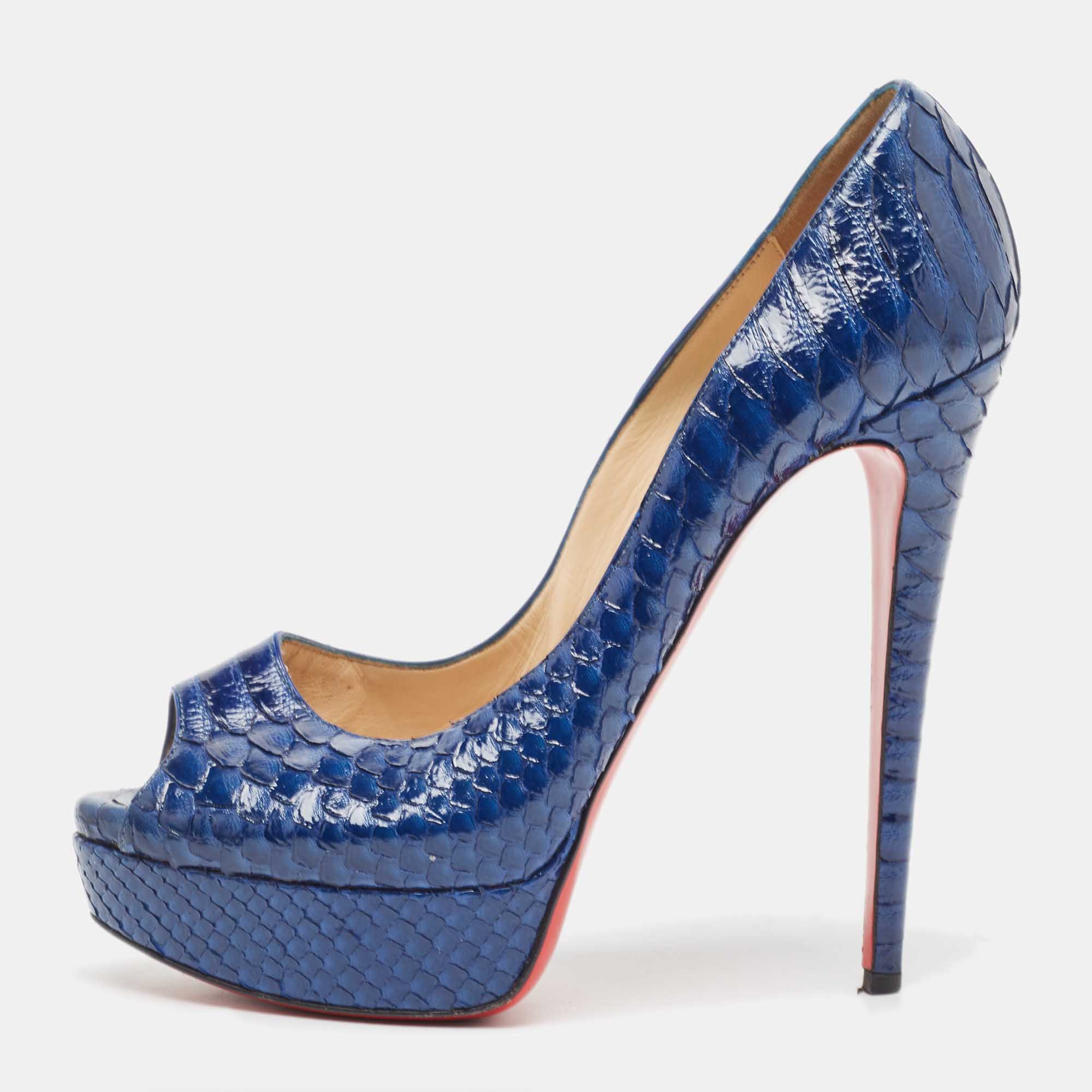 Stand out from the crowd with this luxurious pair of Louboutins that exude high fashion with class. Crafted from python leather this is a creation from their Lady Peep collection. It features a blue shade with peep toes and an architectural shape. Completed with leather insoles stiletto heels and signature red lacquered soles these shoes are elegant.