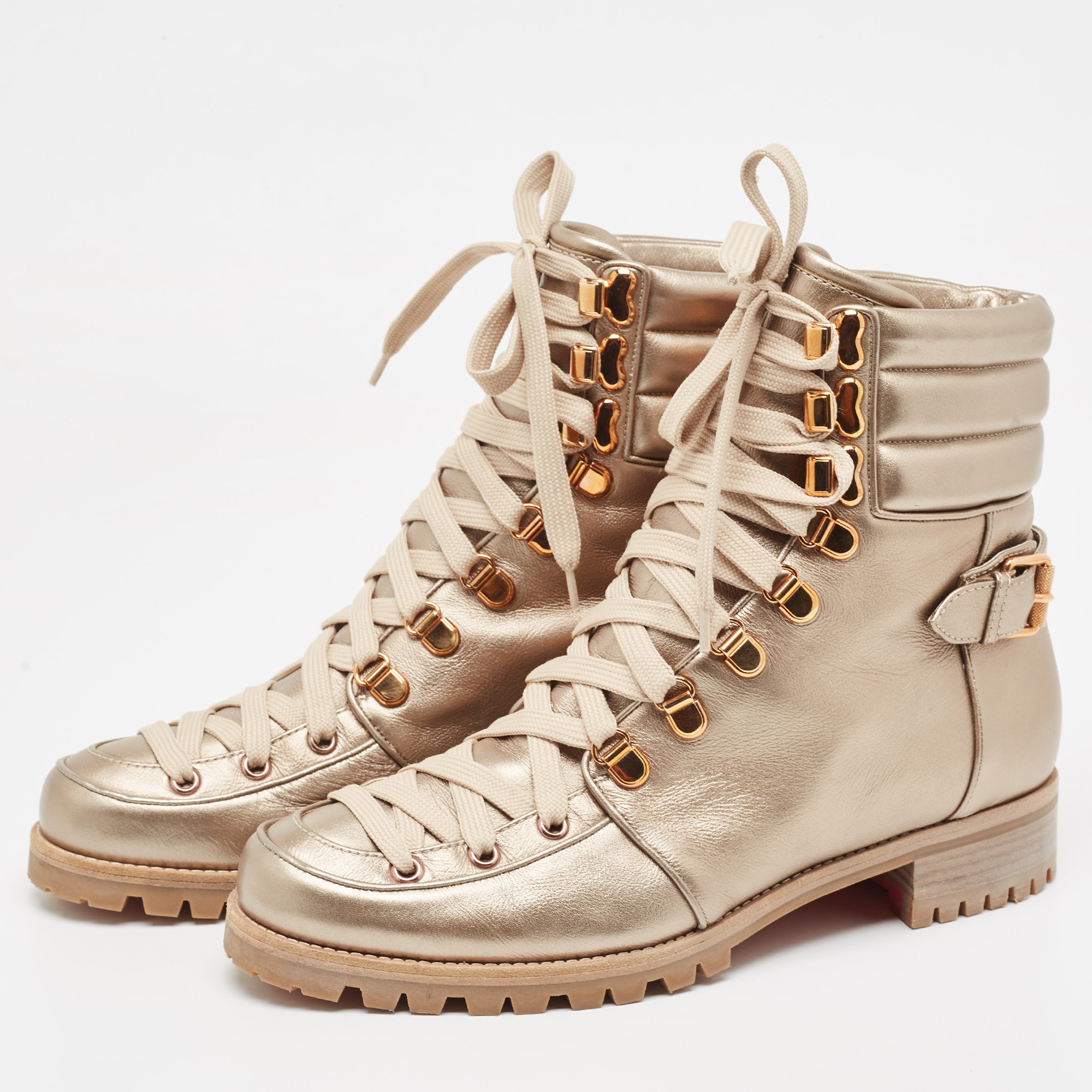 

Christian Louboutin Metallic Gold Leather Combat Boots Size
