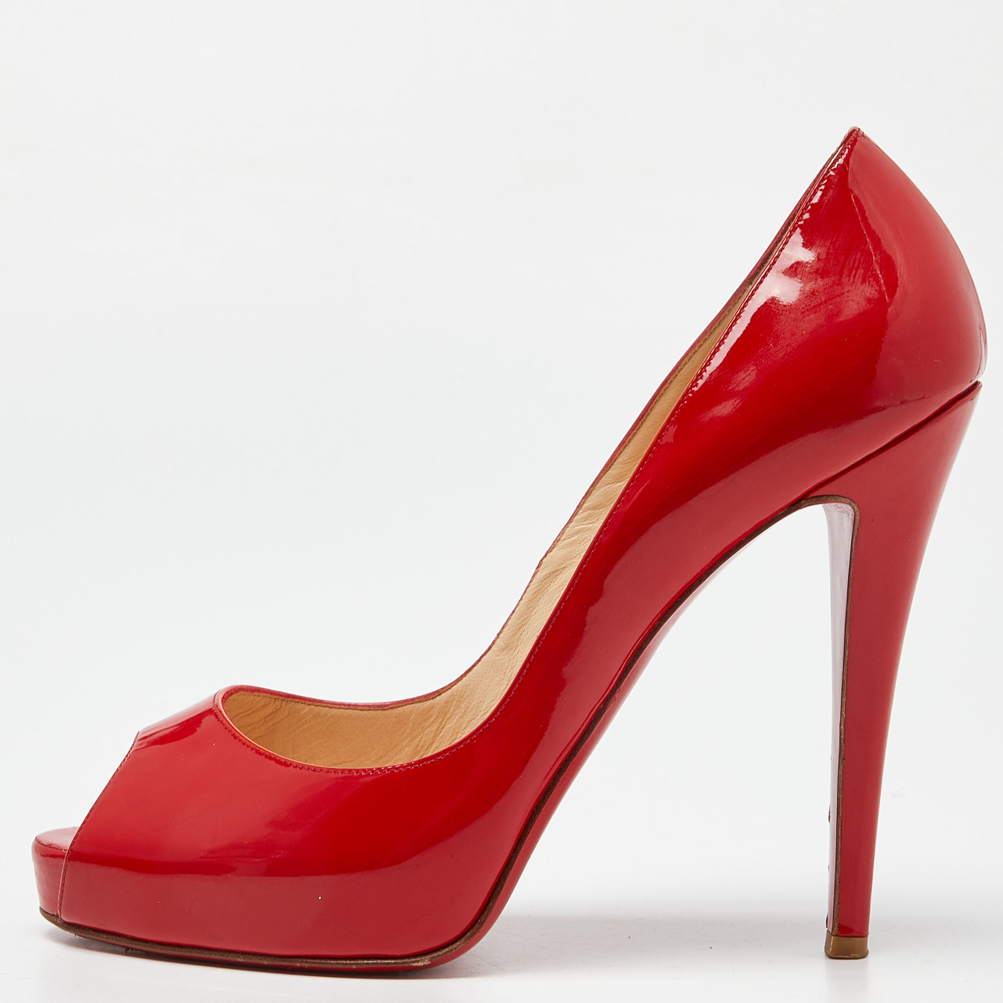 This pair of Christian Louboutin pumps is a timeless classic. Step out in style while flaunting these coral red patent leather pumps ideal for special occasions. They feature peep toes smooth insoles and 13cm heels.