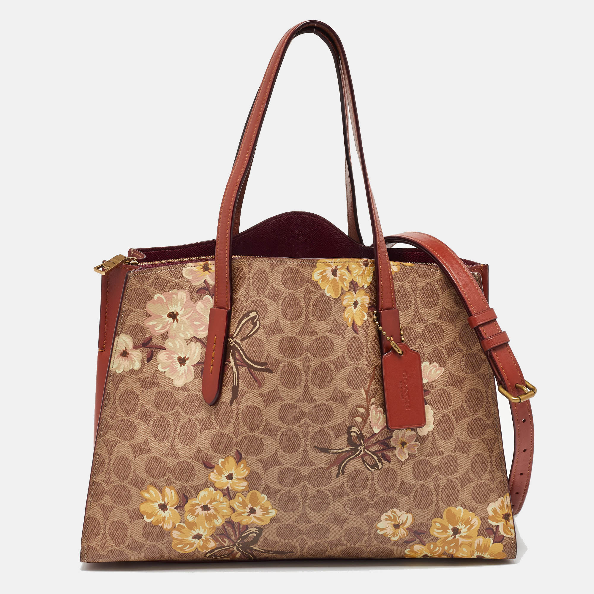 

Coach Brown Prairie Floral Signature Coated Canvas and Leather Charlie Carryall Tote