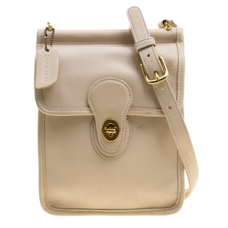 white and beige coach purse