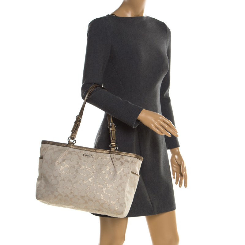 

Coach Beige/Gold Canvas and Leather East West Tote