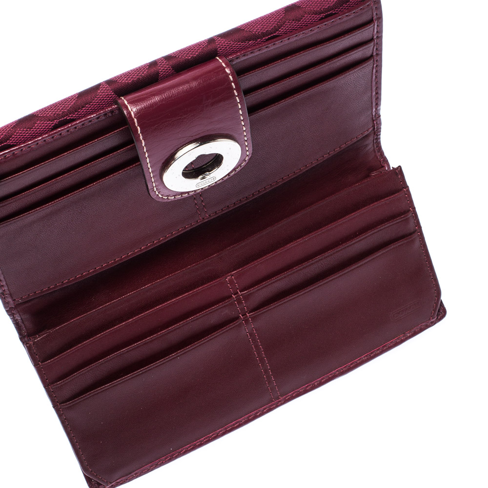 

Coach Burgundy Canvas and Leather Turnlock Continental Wallet