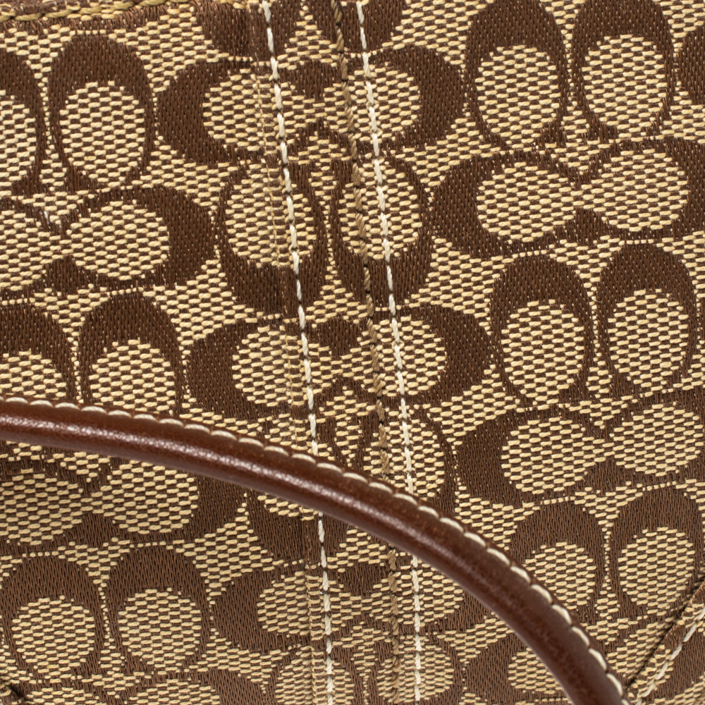 Pre Owned Coach Brown/Beige Signature Canvas and Leather Wristlet Clutch