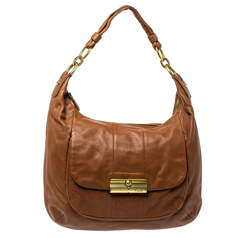 Now heres a bag that is both stylish and functional Coach brings us this gorgeous Kristin hobo crafted from leather and designed with a flap that opens up to a satin interior capable of carrying all your essentials. The piece is complete with a shoulder handle and gold tone hardware.