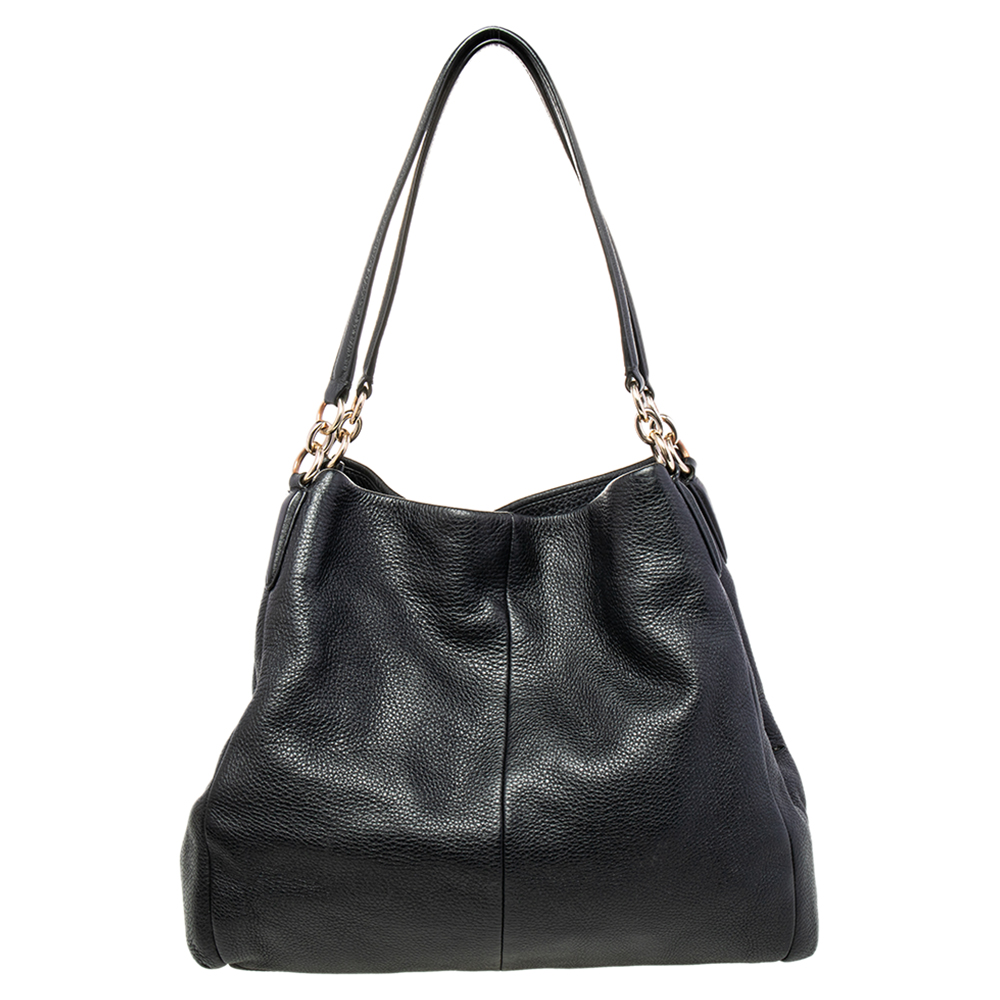 Grab this stylish shoulder bag from Coach to style your everyday looks effortlessly. Crafted from quality leather this Edie bag comes in black. It is styled with dual handles a nylon interior with a zip compartment and two open compartments for all your essentials. It is finished with gold tone hardware. A black shoulder bag like this is hand picked to make you look your best.