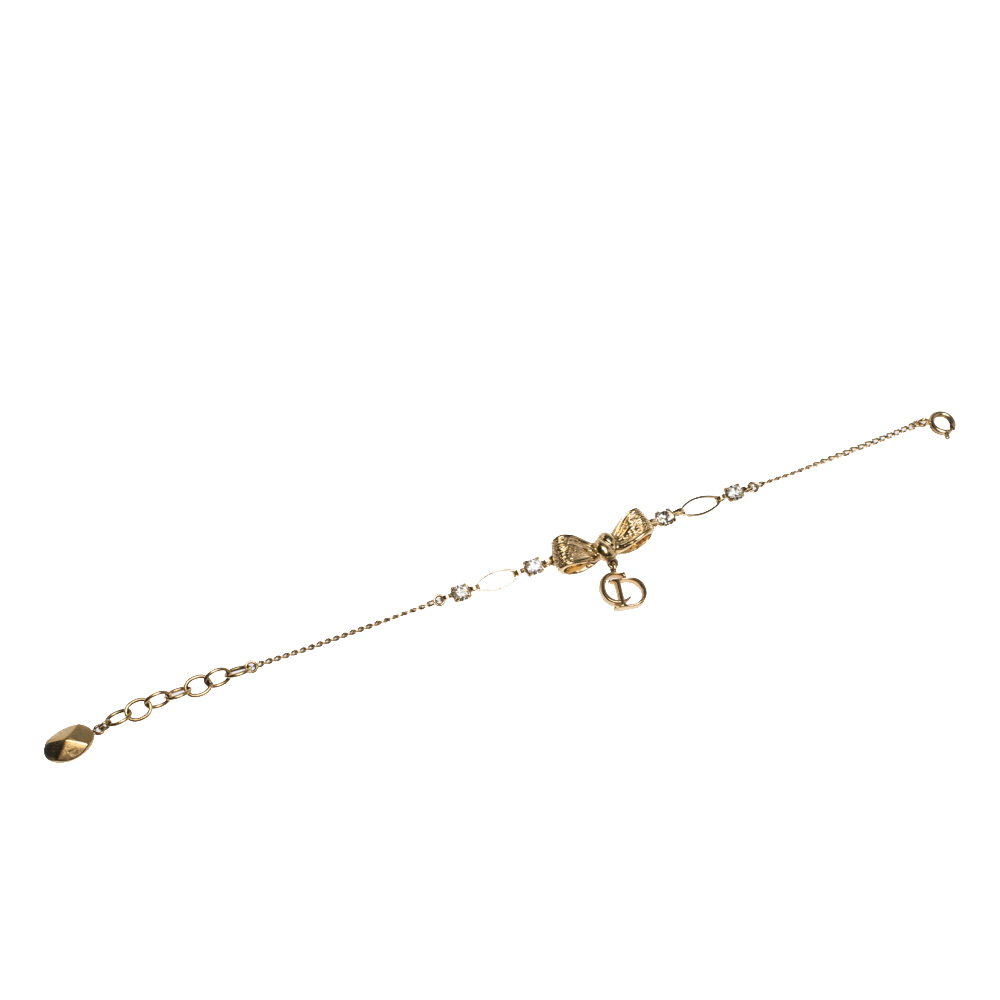 

Dior Crystal Bow Charm Gold Tone Bracelet