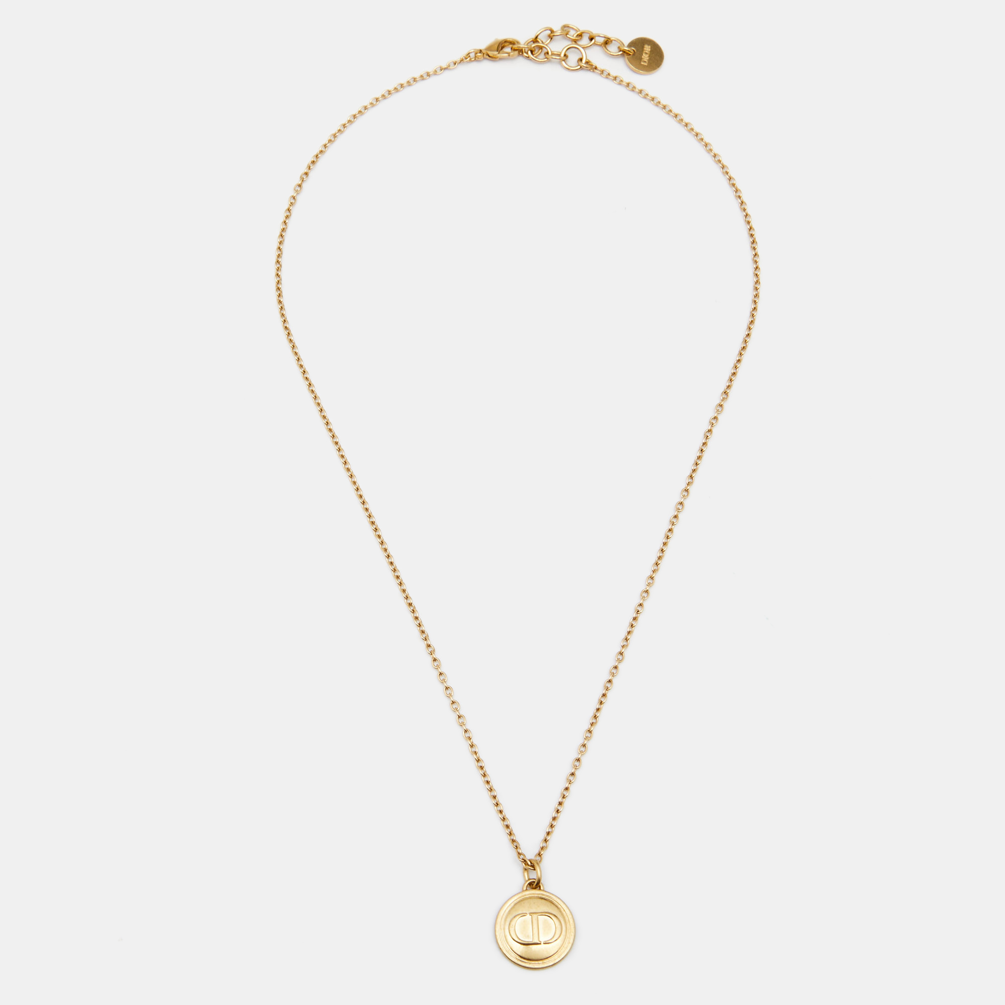 

Dior Gold Tone Logo Embossed Round Pendant Necklace