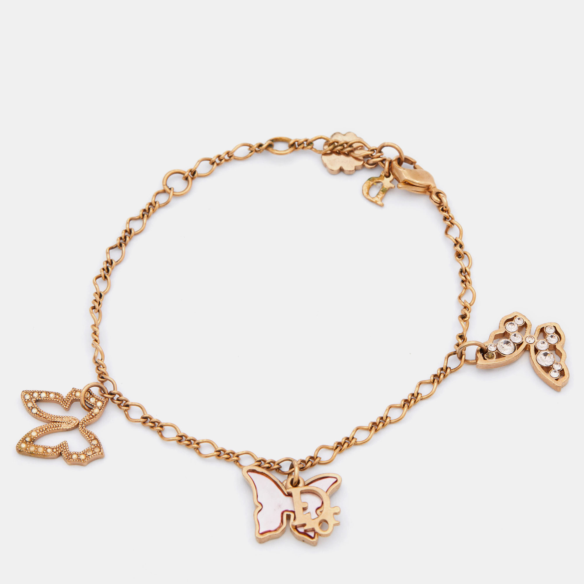 Click to view more detailed imagery on our partner's website Pre-owned Dior Gold Tone Mother Of Pearl Butterfly Charm Bracelet
