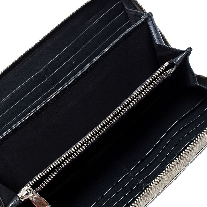 

Dior Metallic Silver Cannage Patent Leather Zip Around Wallet