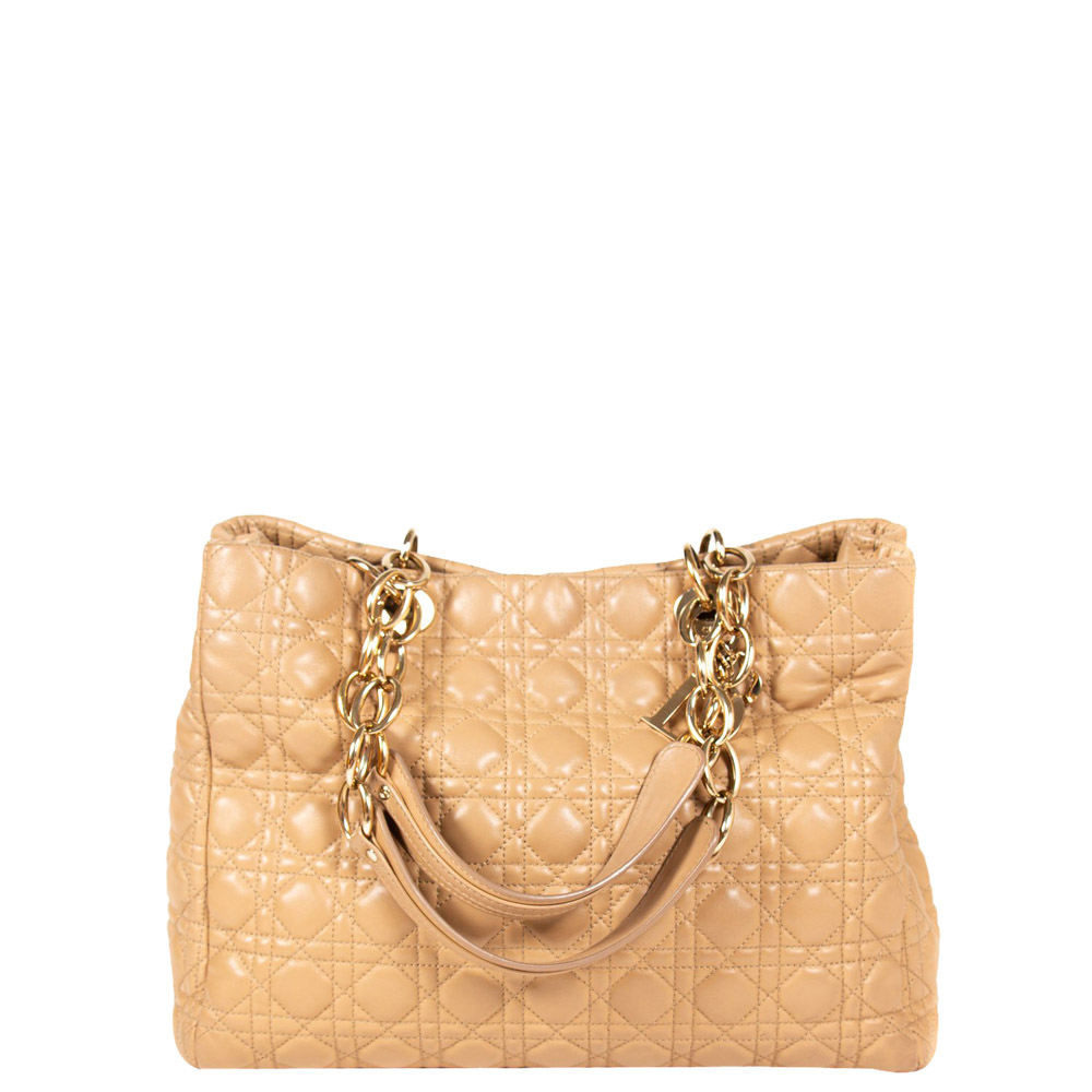 Get yourself this Dior bag to showcase a fashion forward taste. Own this beige bag a perfect match for you. The plush texture of the finest definitive leather used in this bag gives an inimitable shine and dignity to its look.