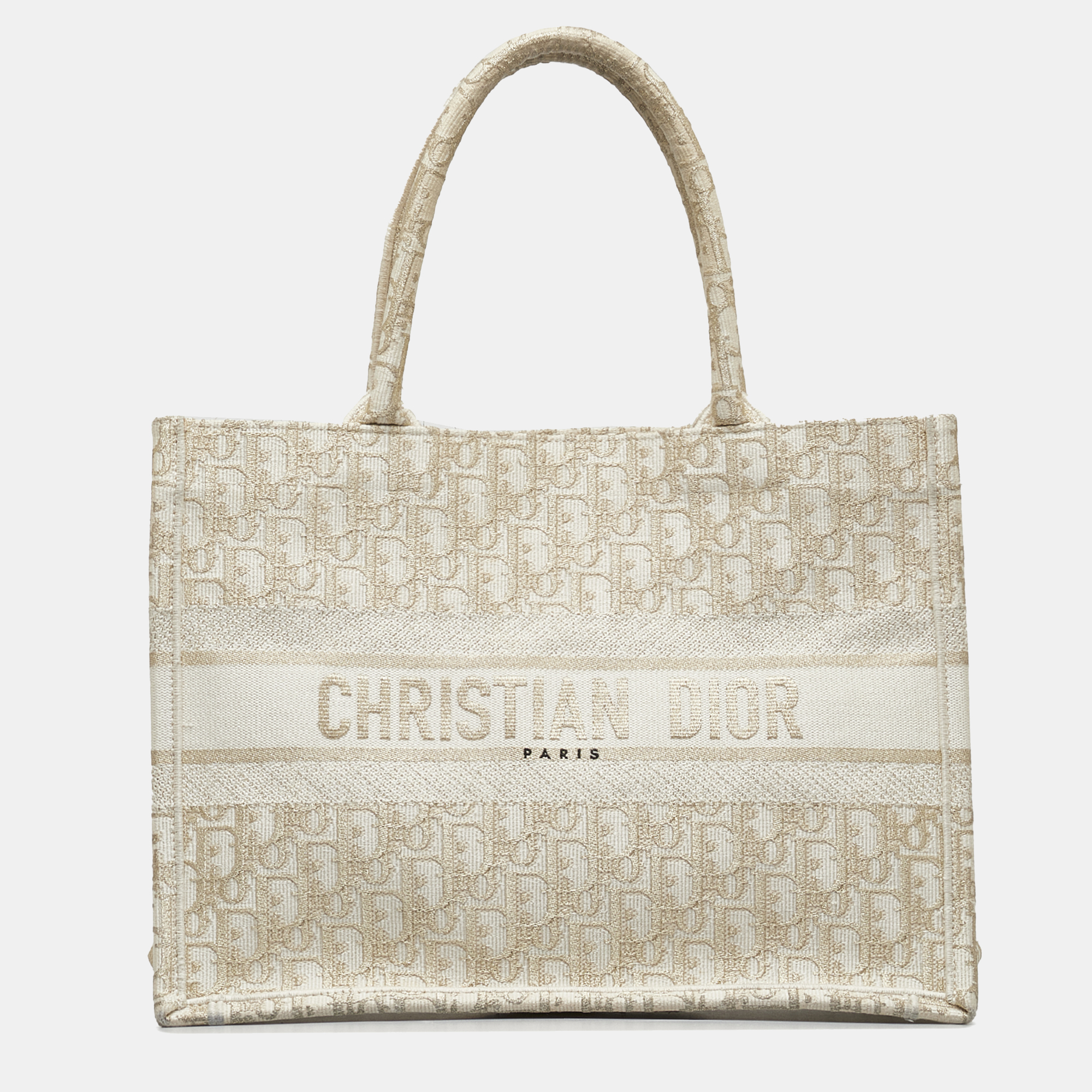 The Book Tote features a canvas body rolled canvas handles and an open top. Elevate your every day with this Dior tote. Meticulously designed it seamlessly blends functionality with luxury offering the perfect accessory to showcase your discerning style while effortlessly carrying your essentials.