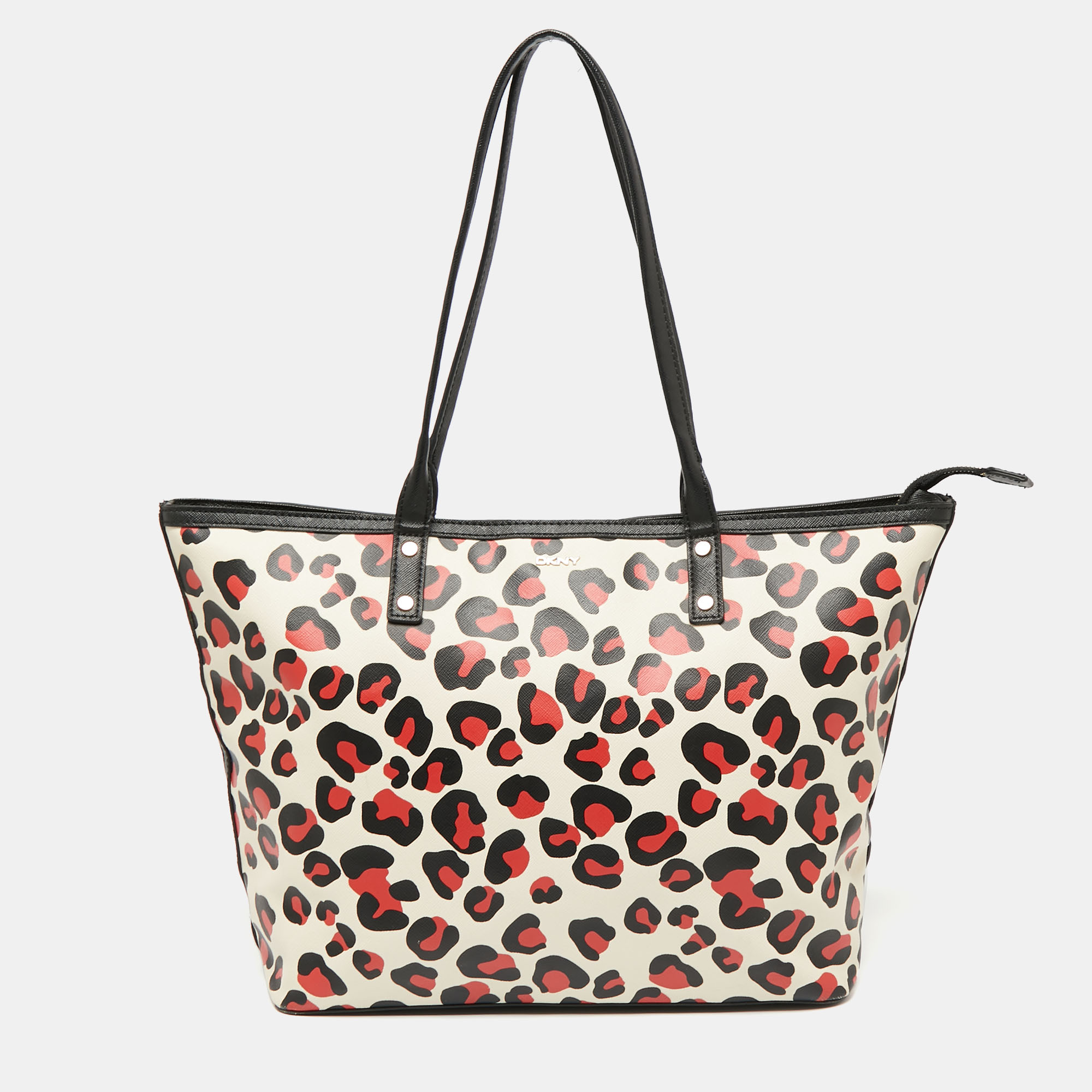 The leopard printed coated canvas of this Dkny tote makes it more appealing. It can be carried easily with dual handles at the top and the satin lined interior of the bag is spaciously sized.