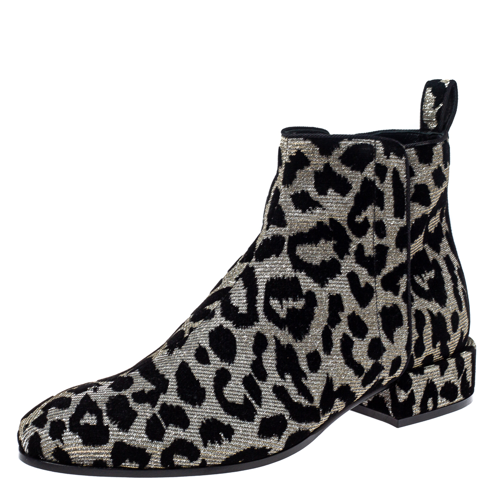 These striking ankle boots from Dolce and Gabbana are a must have to amp up your ensemble. Crafted meticulously from a luxe velvet and lurex they carry a black and silver leopard print for a flattering look. They are styled with almond toes zip closures and small heels.