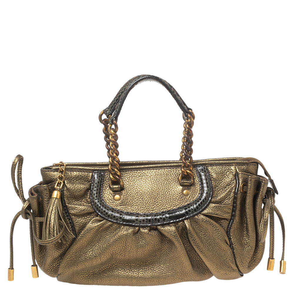 This Dolce and Gabbana bag brings high quality and enduring appeal. It is crafted from metallic olive green leather and designed with snakeskin trims two handles and a spacious fabric interior.