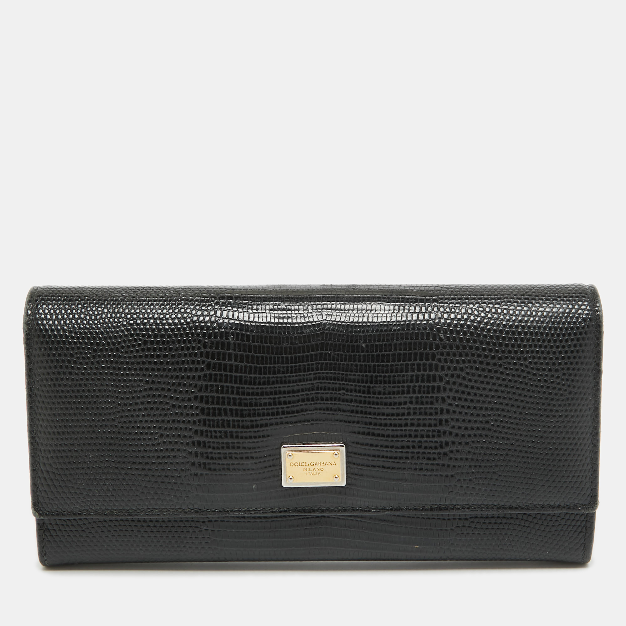 Wallets like this one from Dolce and Gabbana are a necessity since theyre not only functional but also stylish. Crafted from lizard embossed leather this wallet comes with the famous label on the flap which secures multiple slots and compartments to neatly arrange your cards and cash.