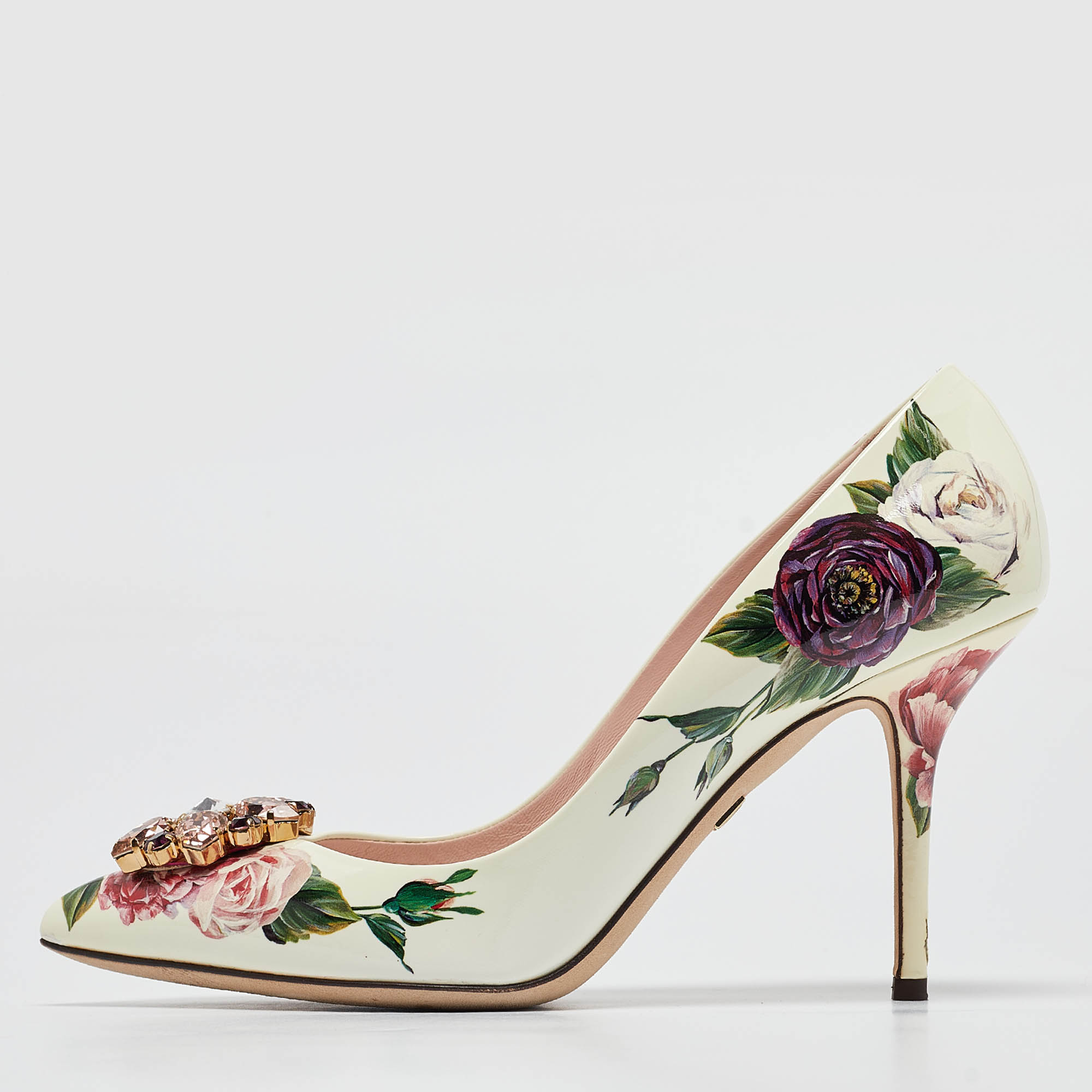 Dolce and Gabbana presents these chic pumps to complement your elegant outfits. Constructed using leather these pointed toe pumps are complete with stiletto heels crystal embellishments and floral prints