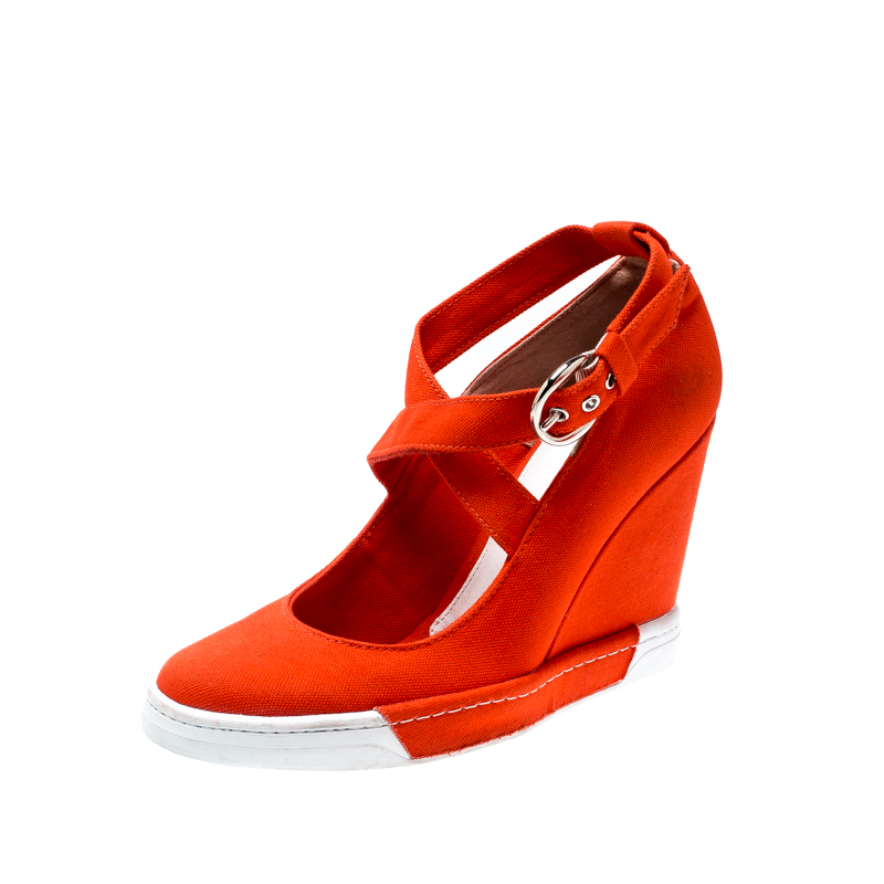مملوكة مسبقًا Dolce And Gabbana Orange Canvas Wedge Heel Cross Strap Platform Pumps Size 40