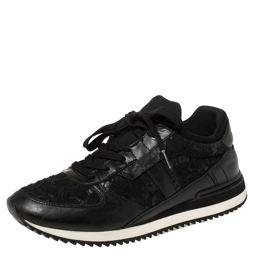 Fall in love with casual wear every time you step out in these low top sneakers from Dolce and Gabbana. Theyve been crafted from lace and leather and styled with round toes and lace ups on the vamps. The black sneakers are endowed with comfort and effortless style.