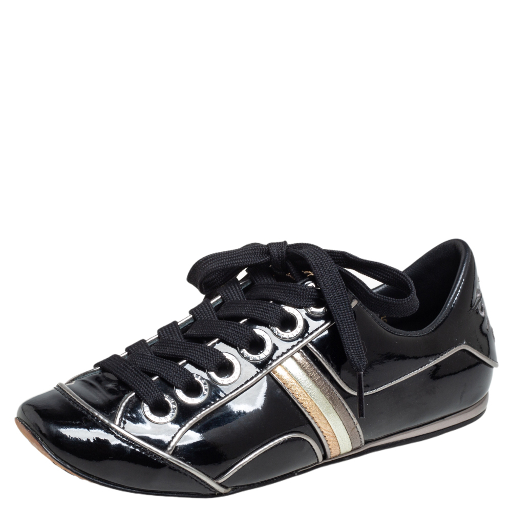 Sporty and stylish Dolce and Gabbanas sneakers are a seamless blend of brilliant craftsmanship and unique ideas. They are crafted from patent leather and feature panels of tricolor leather on the sides. These sneakers are finished off with round toes and laces on the vamps.