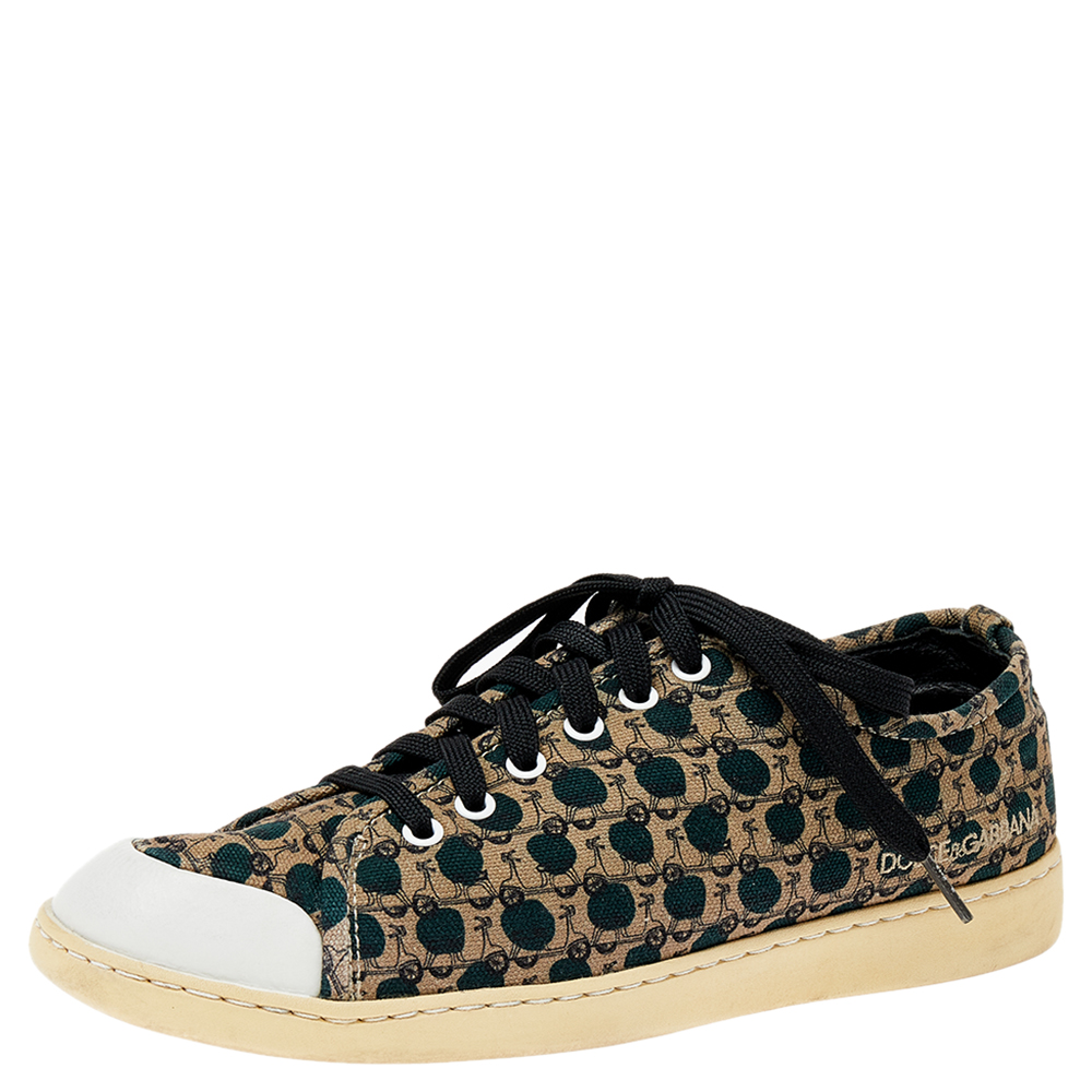 If comfort is a pair of shoes it would be this one by Dolce and Gabbana. Crafted from printed canvas the low top sneakers feature round toes leather trims lace up vamps and brand detailing. Durable rubber soles complete the pair.