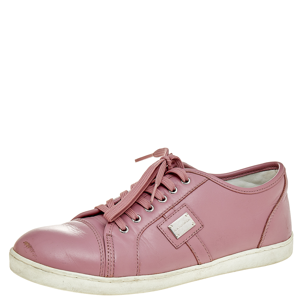 Brighten up your attire by donning these beautiful sneakers from Dolce and Gabbana. These low top sneakers feature pink leather on the exterior with matching lace ups and a silver toned logo plaque decorating the vamps. Comfortable to use and stylish in their appearance they are the ideal pick for daily wear.