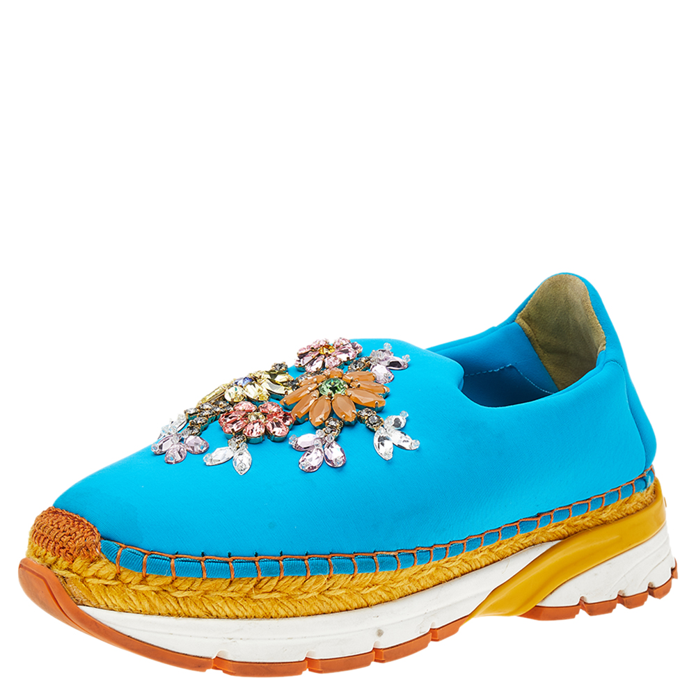 Adorn your feet by wearing these sneakers from Dolce and Gabbana. They are created using blue neoprene on the exterior and are decorated with dainty crystal embellishments on the vamps. These sneakers are made in a slip on style and come with a fabric lining. Add a pop of color to your attire by wearing these beauties.