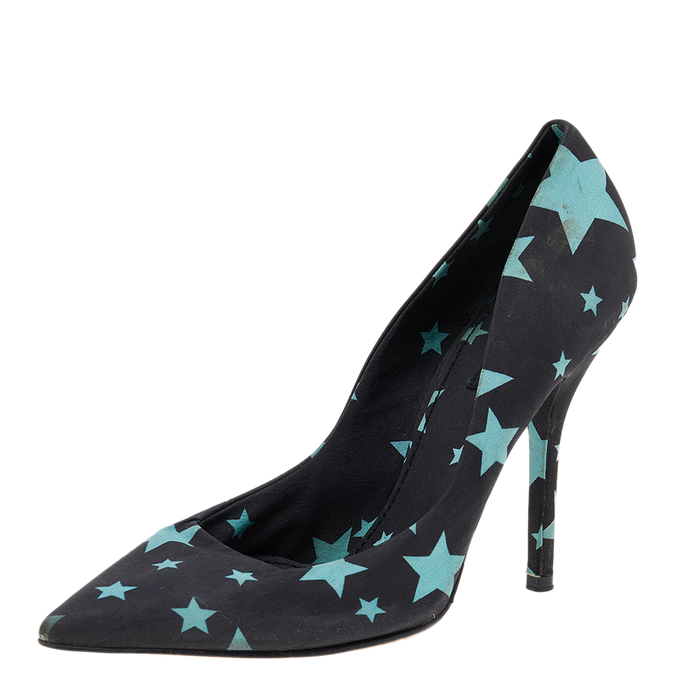 Pick these pumps from Dolce and Gabbana and make a statement every time you step out. Crafted from fabric accented with star prints they are very glamorous. They are styled with pointed toes 11 cm heels leather lining insoles and soles. Grab these beauties now.