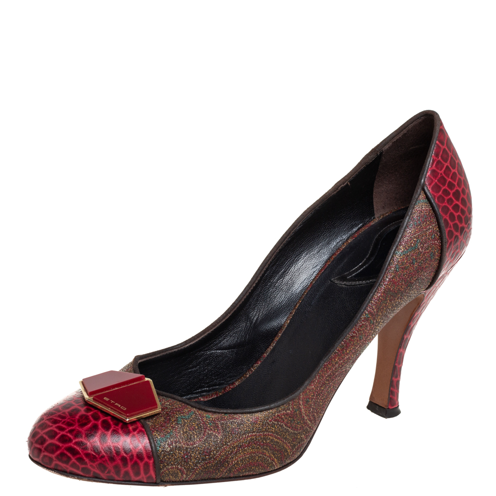 Add a luxe finish to your ensemble with this pair of pumps from the house of Etro. Finely crafted from paisley coated canvas and croc embossed leather these shoes will offer comfortable support. The round toe pumps are set atop 11 cm heels.