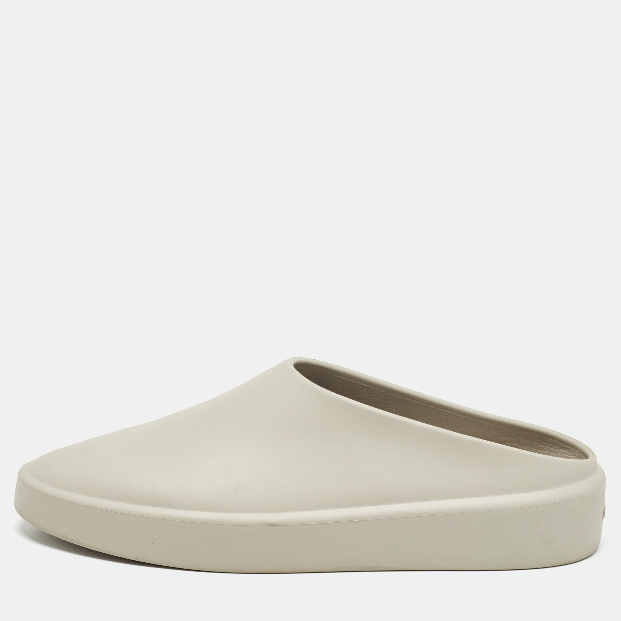 Let this comfortable pair be your first choice when youre out for a long day. These Fear of God flat mules are made of rubber in a snug closed toe design.