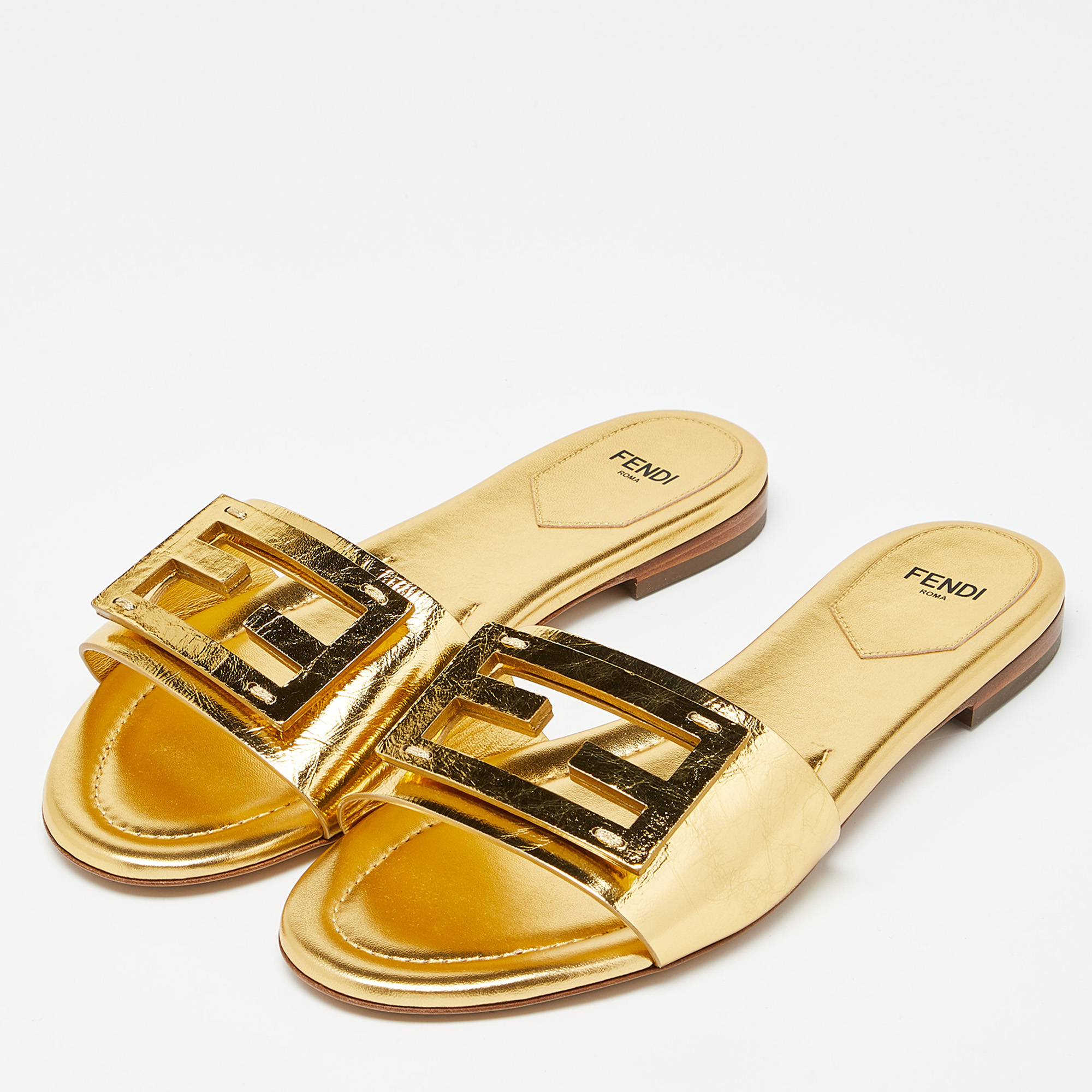 

Fendi Metallic Gold Leather Baguette Flat Slides Size