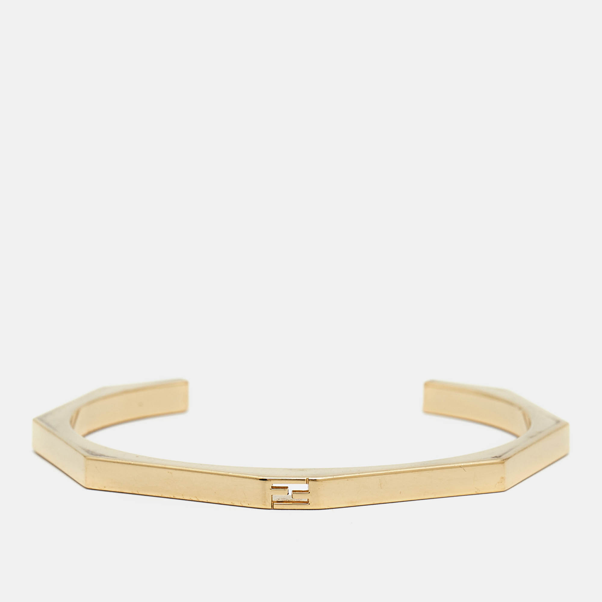 The Fendi Baguette bracelet blends modern elegance with classic design. Crafted in gleaming gold tone this open cuff bracelet features subtle Fendi branding and a sleek minimalist look making it a versatile accessory that adds a touch of sophistication to any outfit.