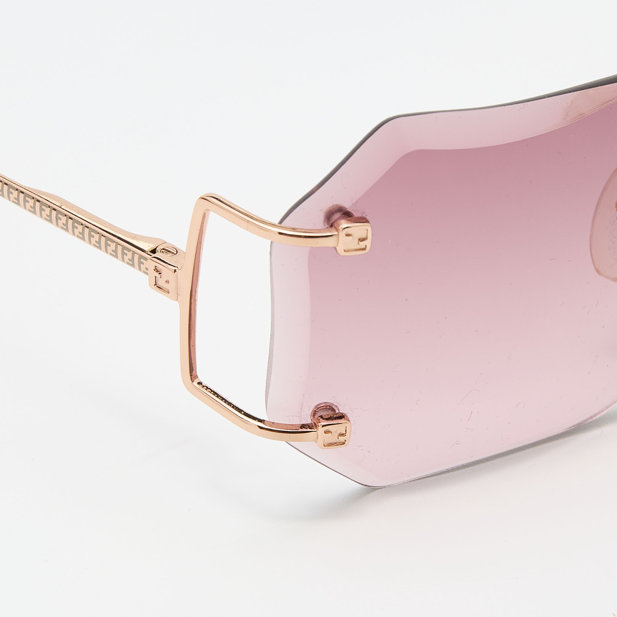 

Fendi Gold Tone/ Purple Rimless Sunglasses