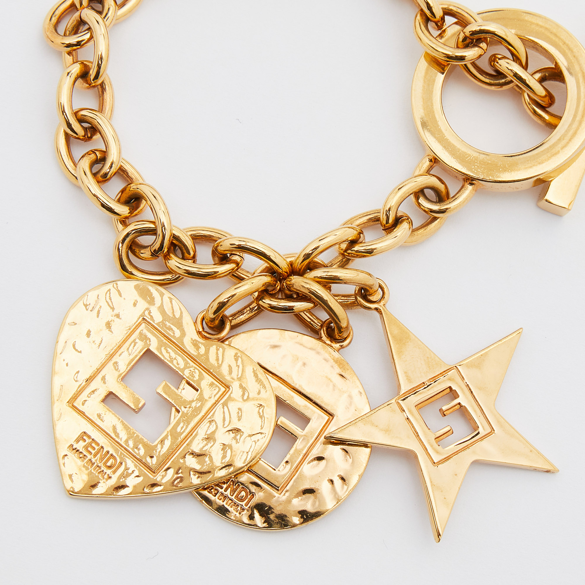 

Fendi Gold Tone Heart Star Charm Chain Link Toggle Bracelet